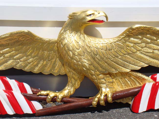 A Patriotic carved American Eagle with flag banners